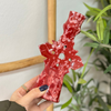 Speckled red candle holder
