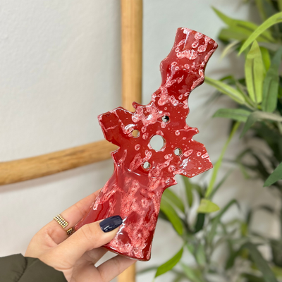 Speckled red candle holder