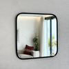 Square mirror in black brass