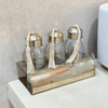 Set of 3 glass bottles with silver-plated brass holder for bathroom