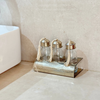 Set of 3 glass bottles with silver-plated brass holder for bathroom