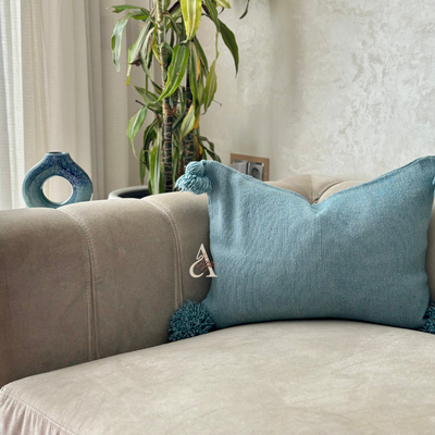 Handmade cushion cover with turquoise pompoms 50cmx40cm