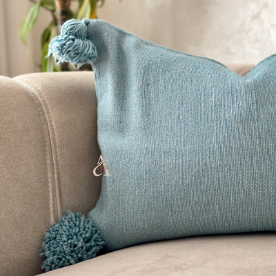 Handmade cushion cover with turquoise pompoms 50cmx40cm