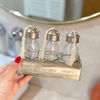 Set of 3 glass bottles with silver-plated brass holder for bathroom