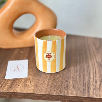 Light orange striped handmade terracotta candle with Amber scent