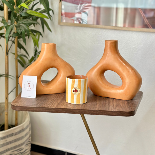 Light orange striped handmade terracotta candle with Amber scent