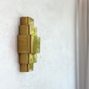 Tagant wall light in gilded brass