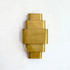 Tagant wall light in gilded brass