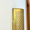 Khmissa wall light in gilded brass
