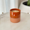Handmade orange terracotta candle with Musk scent