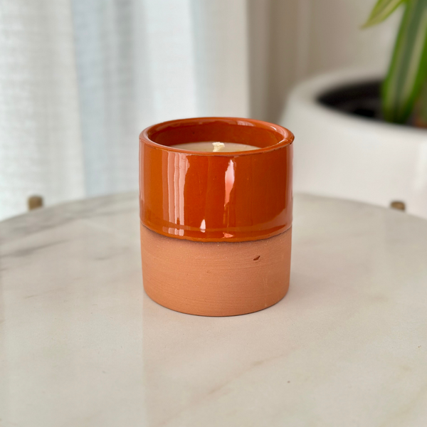 Handmade orange terracotta candle with Musk scent
