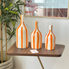 Striped orange bottle vase