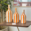Striped orange bottle vase