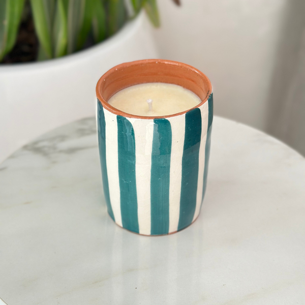 Handmade petroleum blue striped terracotta candle with orange blossom scent