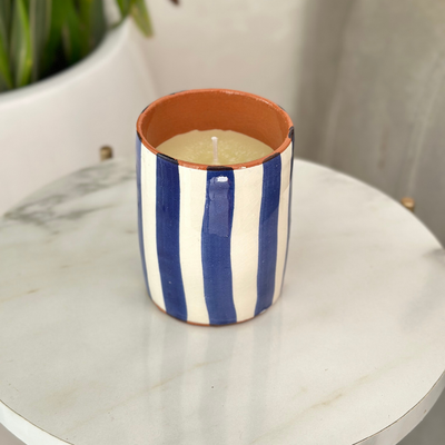 Handmade blue striped terracotta candle with Amber scent