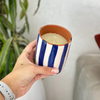 Handmade blue striped terracotta candle with Amber scent
