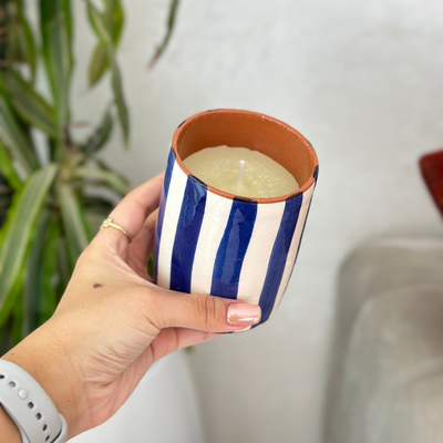 Handmade blue striped terracotta candle with Amber scent