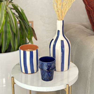 Handmade blue striped terracotta candle with Amber scent