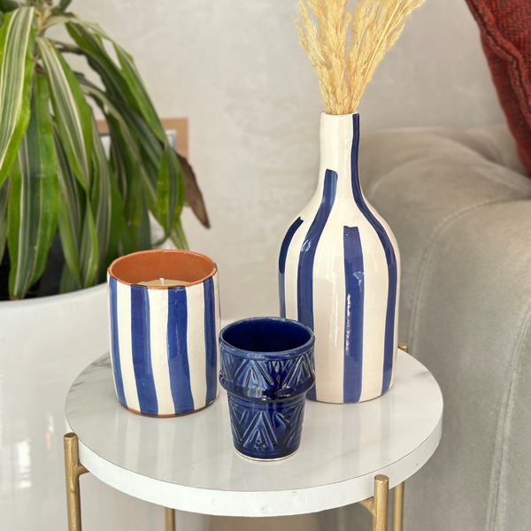 Handmade blue striped terracotta candle with Amber scent