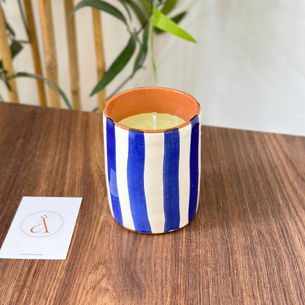 Handmade blue striped terracotta candle with Amber scent