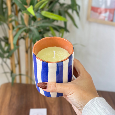 Handmade blue striped terracotta candle with Amber scent