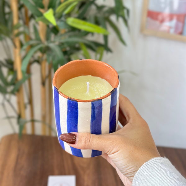 Handmade blue striped terracotta candle with Amber scent