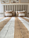 Handmade printed throw with beige, white, and black pompoms 110" x 79"