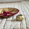 Round candle holder in gold-plated brass