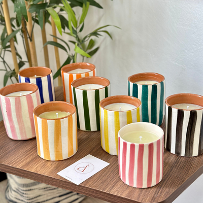 Light orange striped handmade terracotta candle with Amber scent