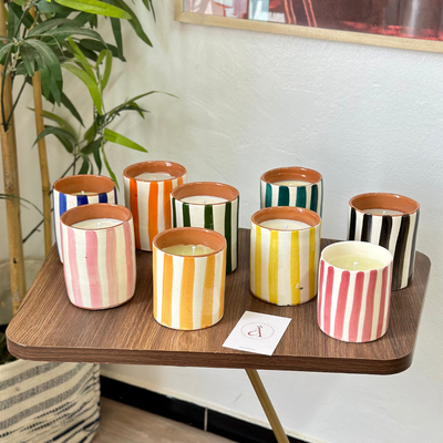 Light orange striped handmade terracotta candle with Amber scent