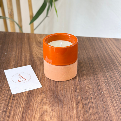 Handmade orange terracotta candle with Musk scent
