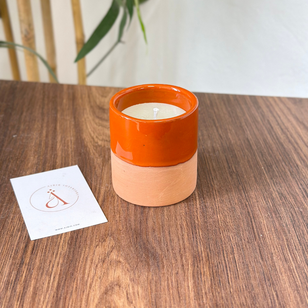 Handmade orange terracotta candle with Musk scent